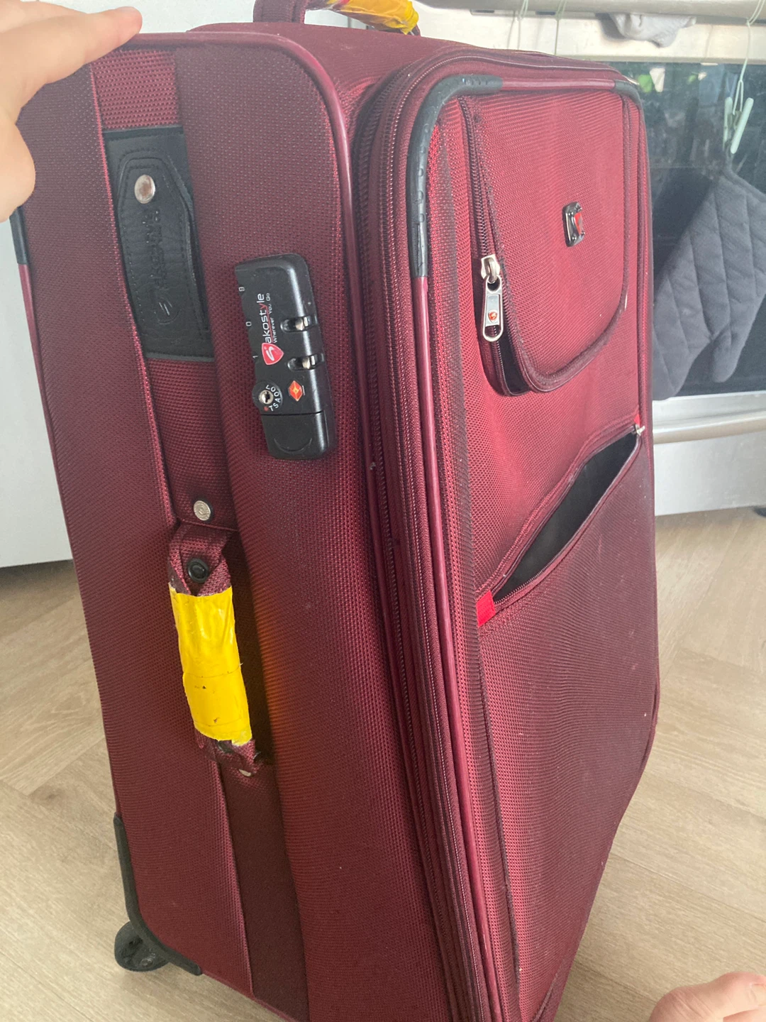 Suitcase ( red, medium size) decent condition