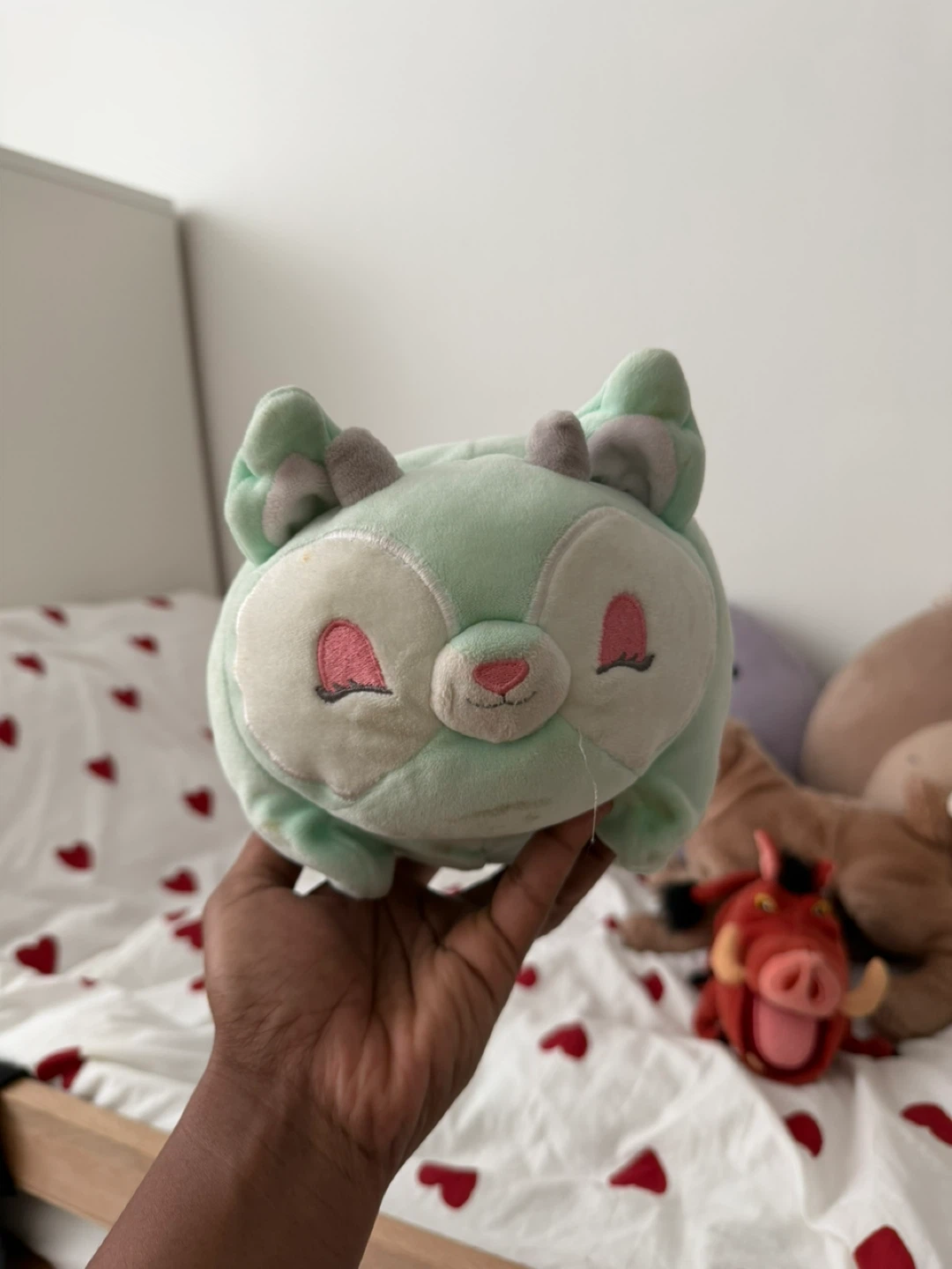 Plush toys (duck, pig, green creature)