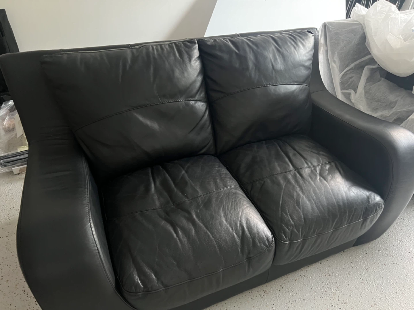 Black genuine Leather Loveseat