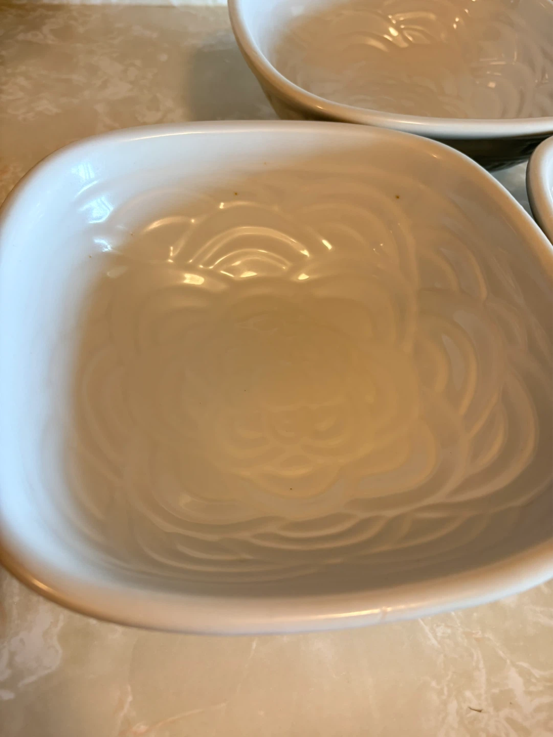 Set of 3 White Ceramic Bowls with Embossed Flower Design