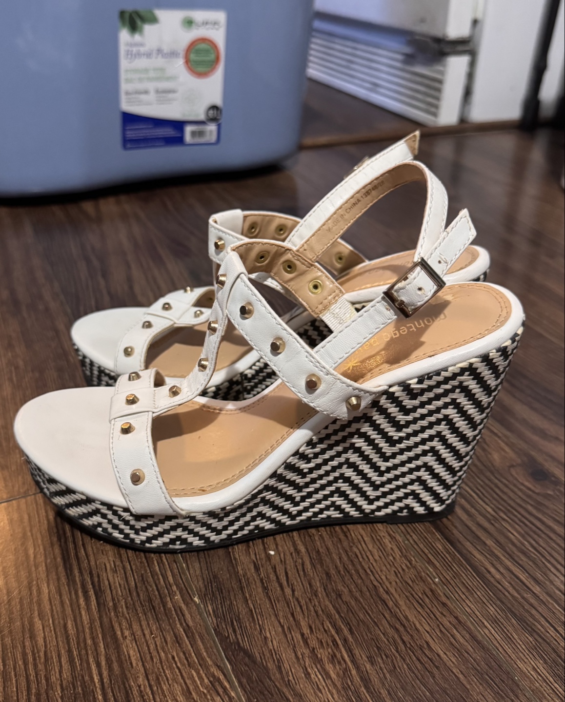 White wedge sandals with black and white patterned heel