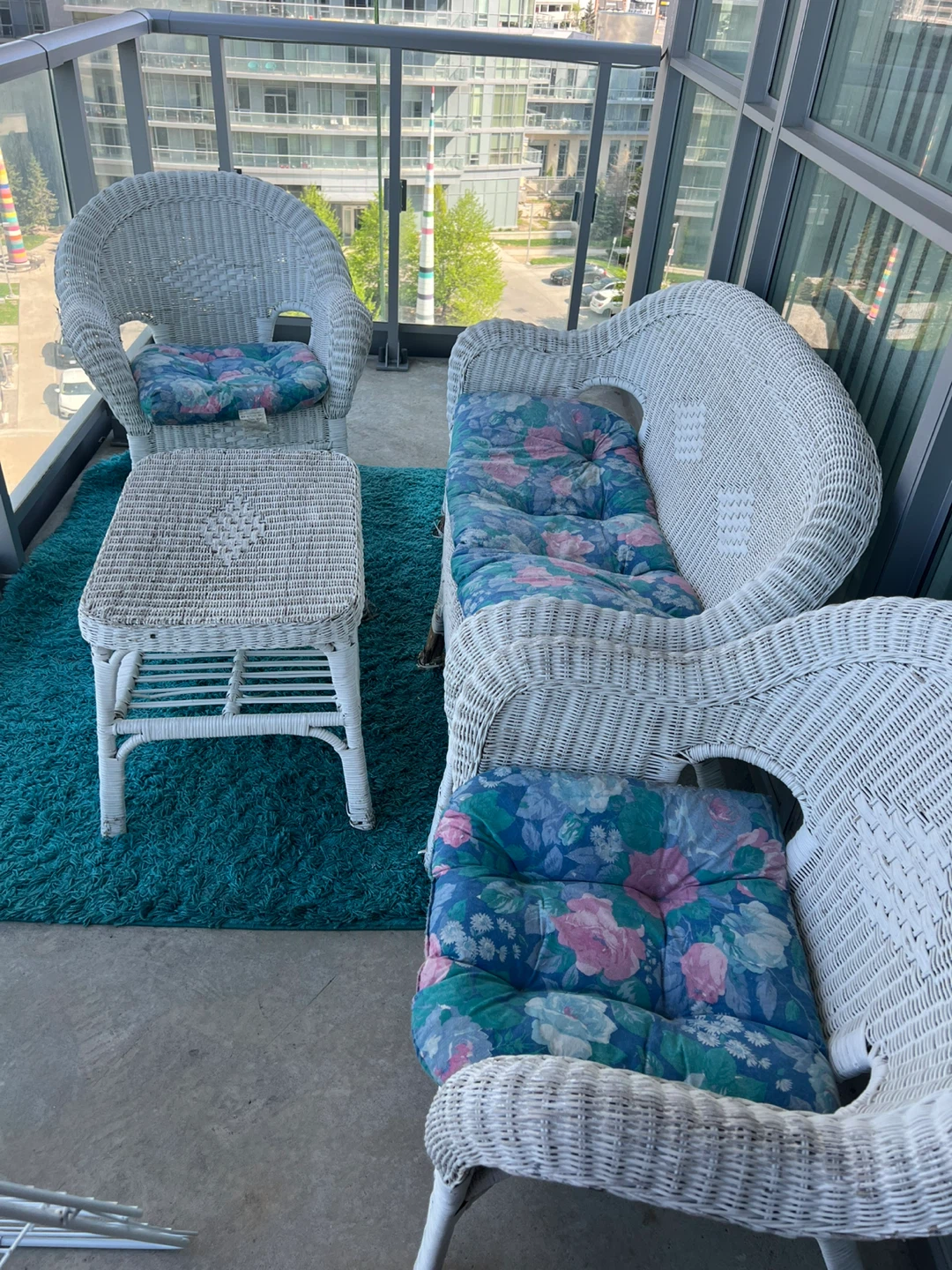 Wicker patio set with floral cushions