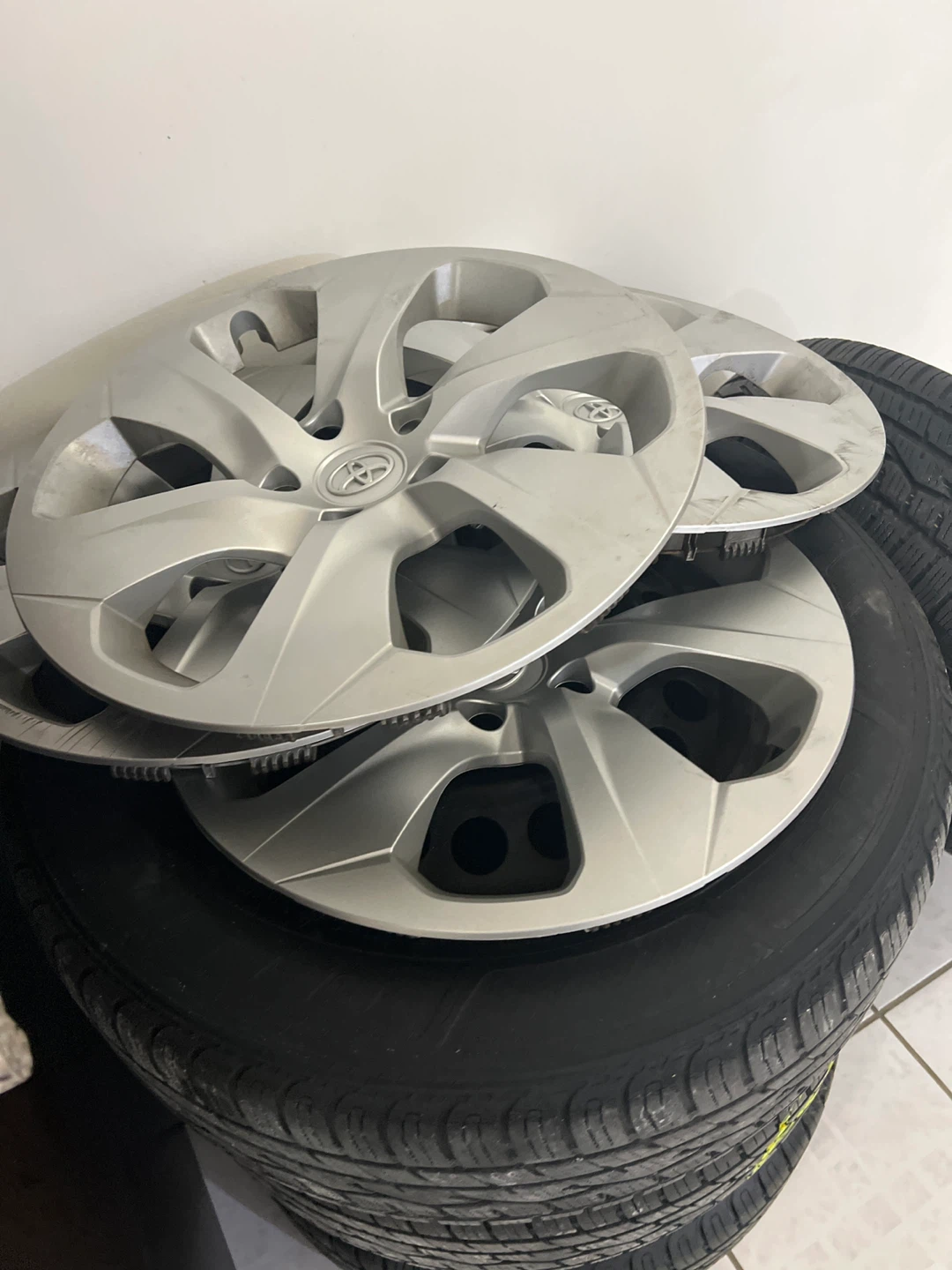 Set of 4 Toyota Hubcaps and Tires - photo 2