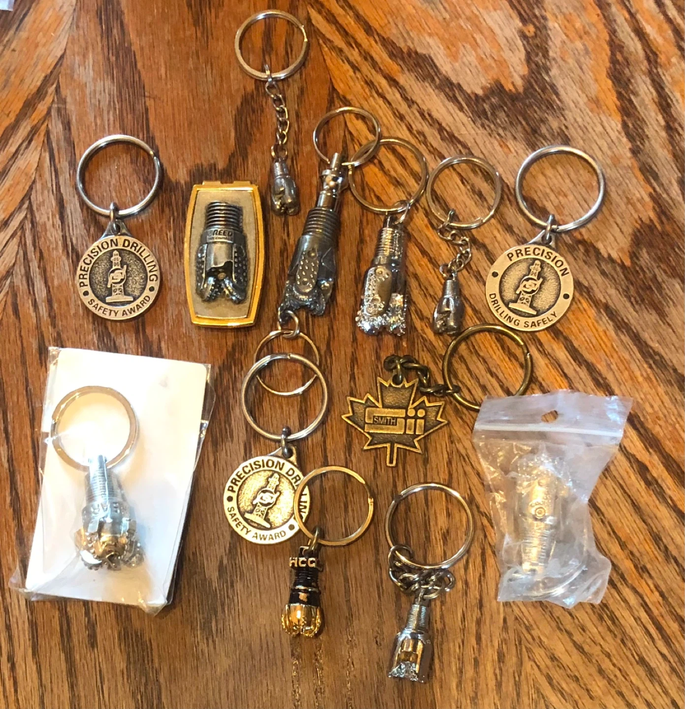 13 oil field key chains and 1 money clip
