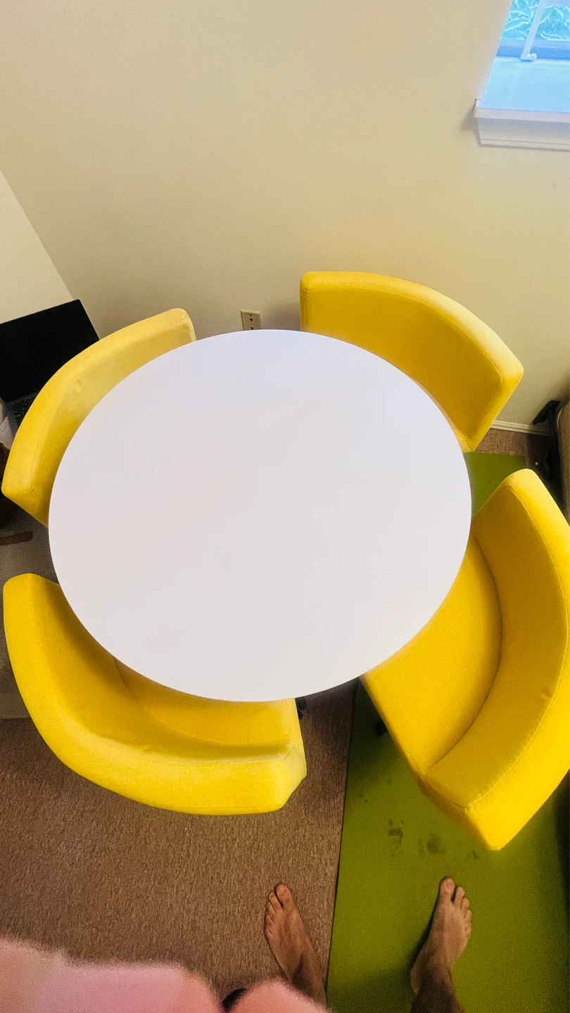 White Round Table with 4 Yellow Chairs