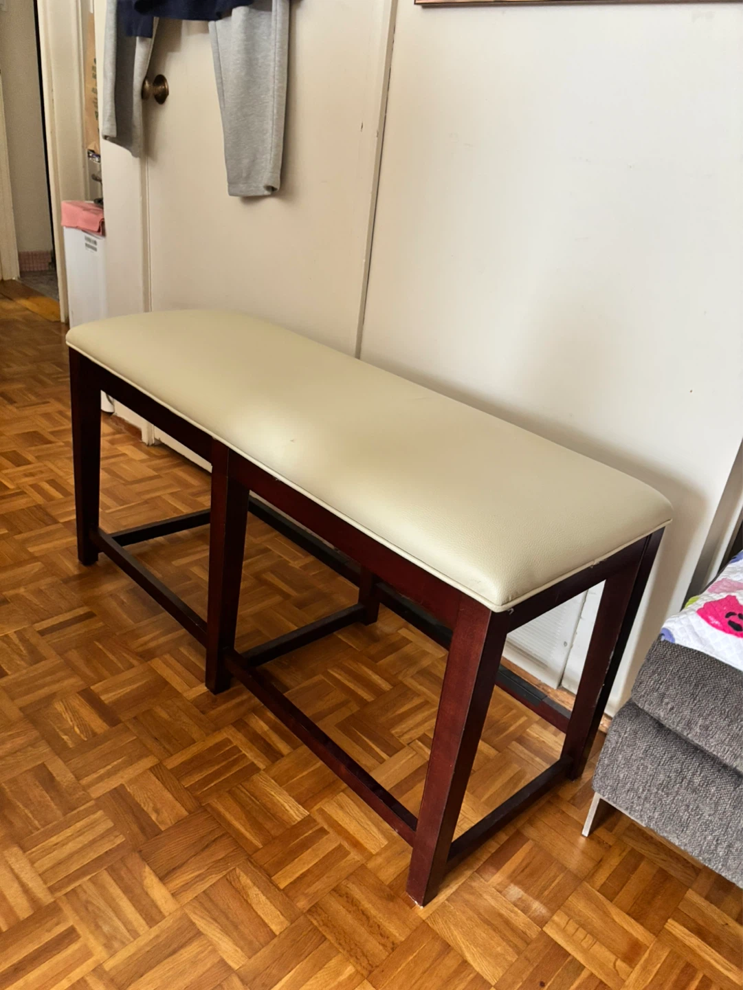 Cream Faux Leather Bench with Dark Wood Legs