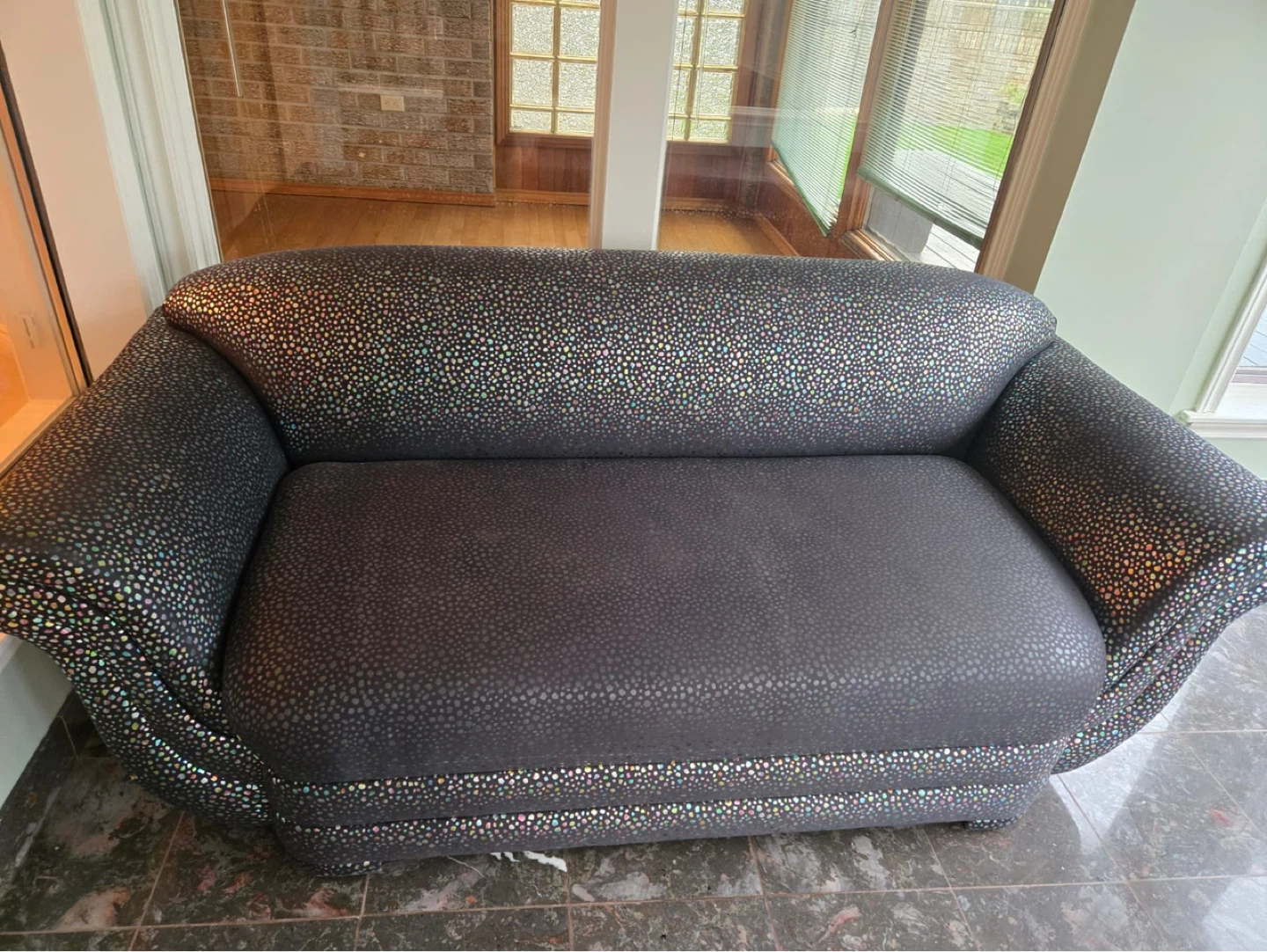 Black Sofa with Speckled Design