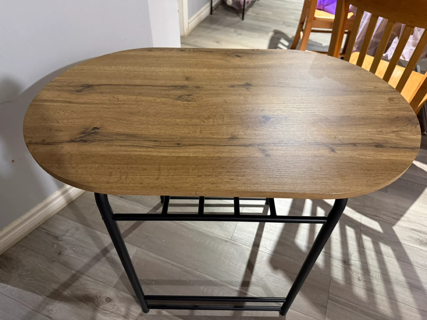 Oval Wood-Look Coffee Table with Black Metal Legs
