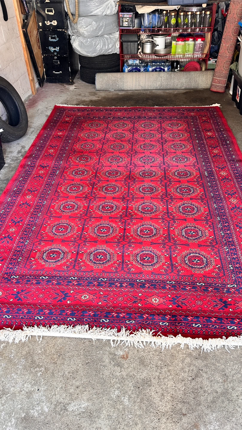 Beautiful Afghan-style area rug in rich traditional patterns.