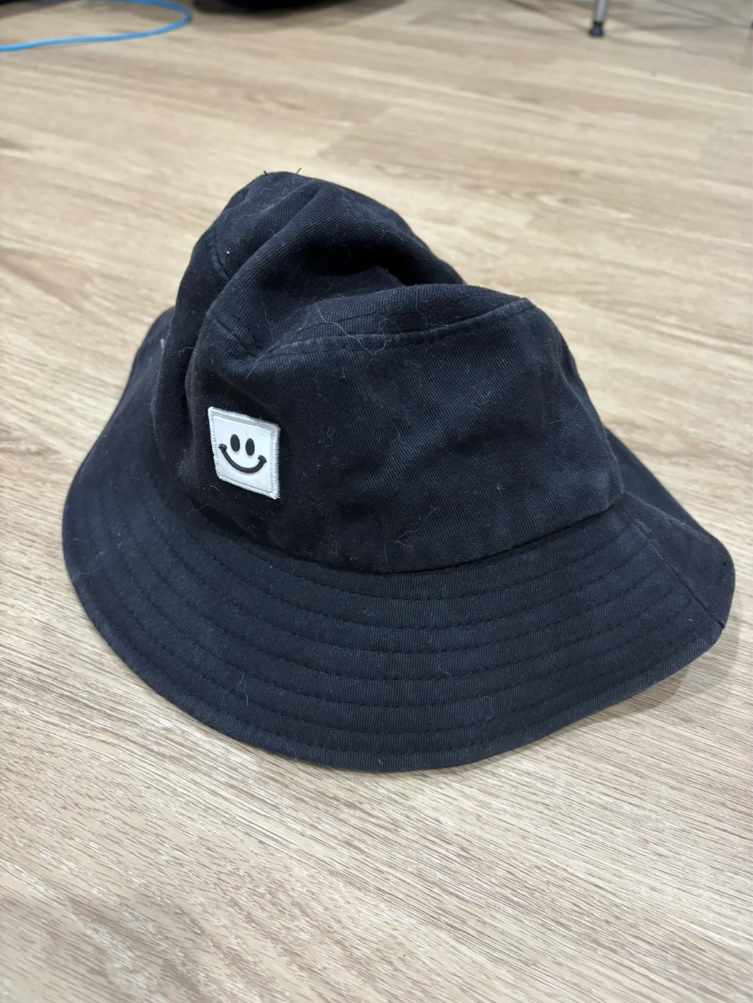 Black Bucket Hat with Smiley Face Patch