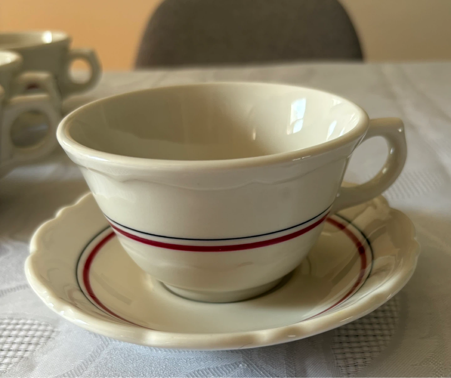 White Ceramic Cups and Saucers with Red and Blue Stripe