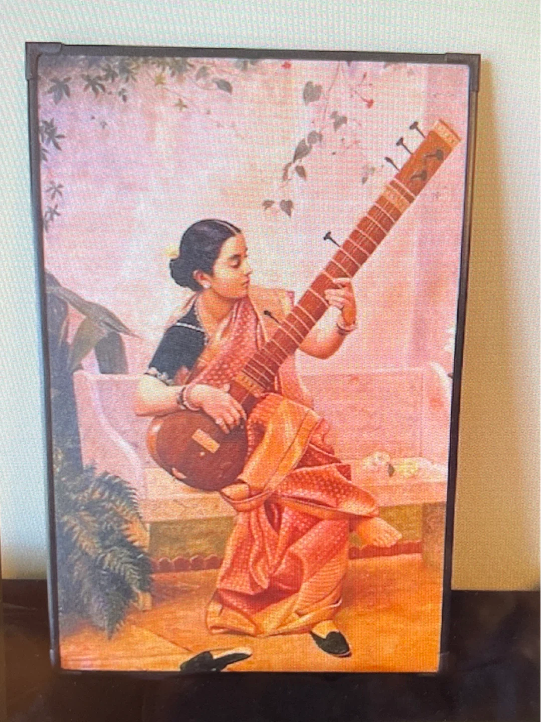 Framed Canvas Print of Woman Playing Sitar