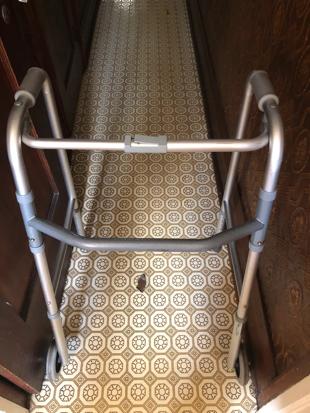 Folding walker with wheels