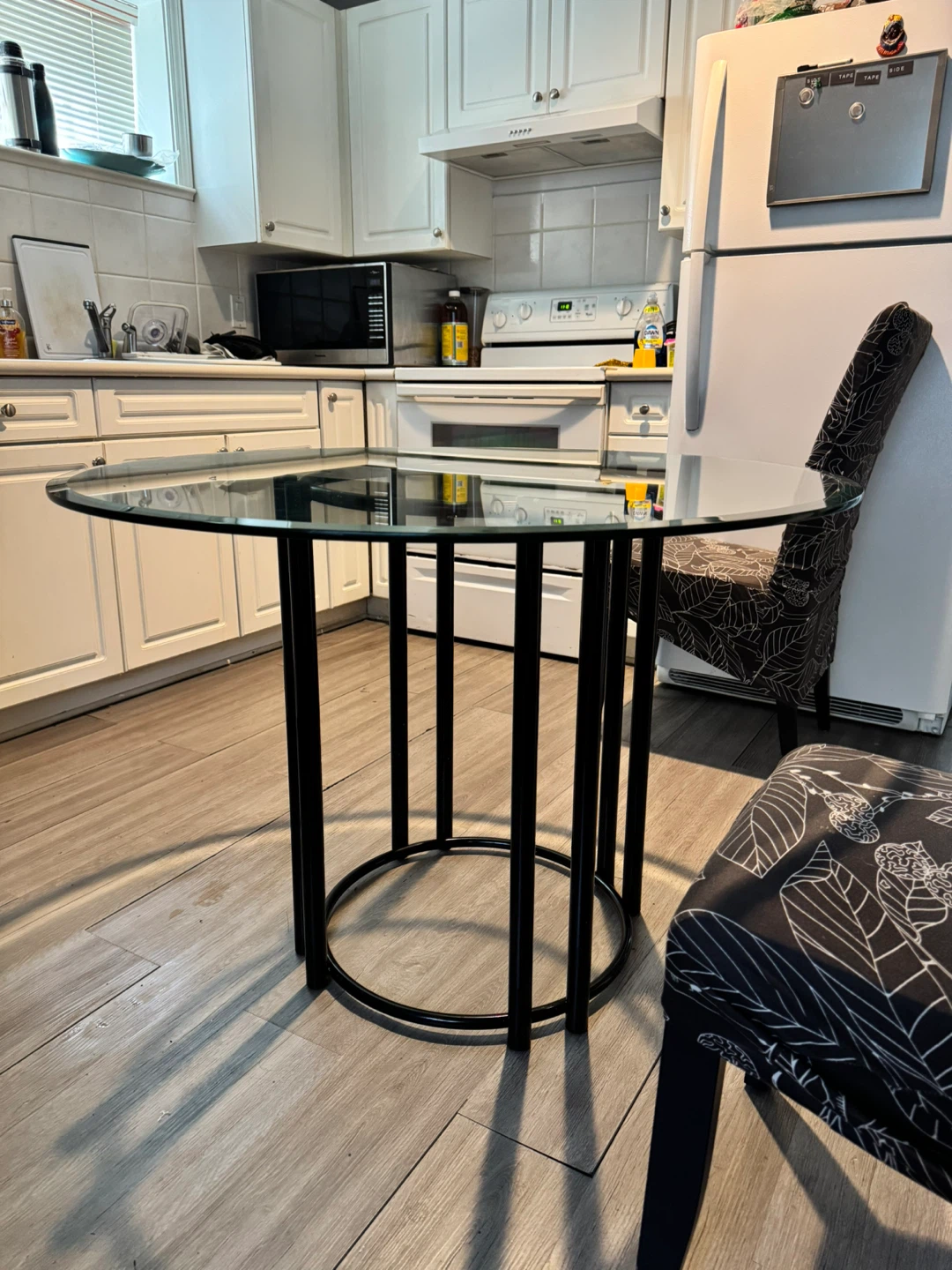 Round Glass Dining Table with Black Metal Base - photo 2