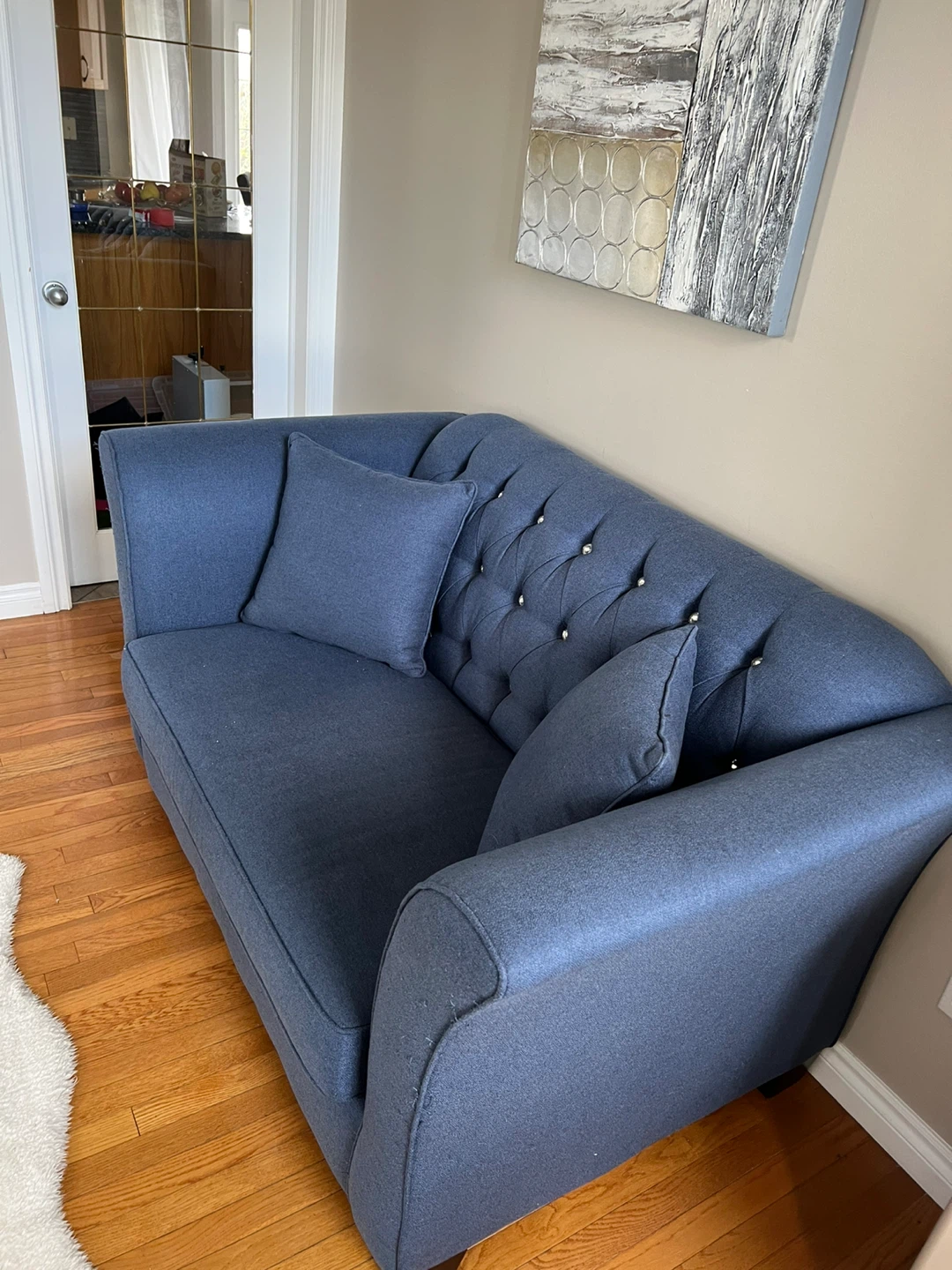 Blue Tufted Sofa with Decorative Pillows