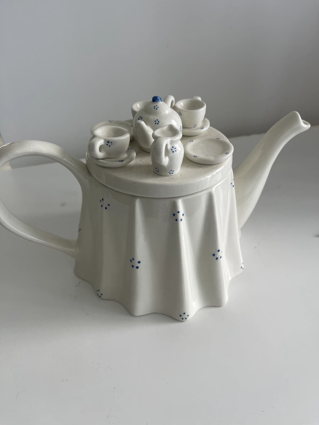 Ceramic Teapot with Miniature Tea Set Design