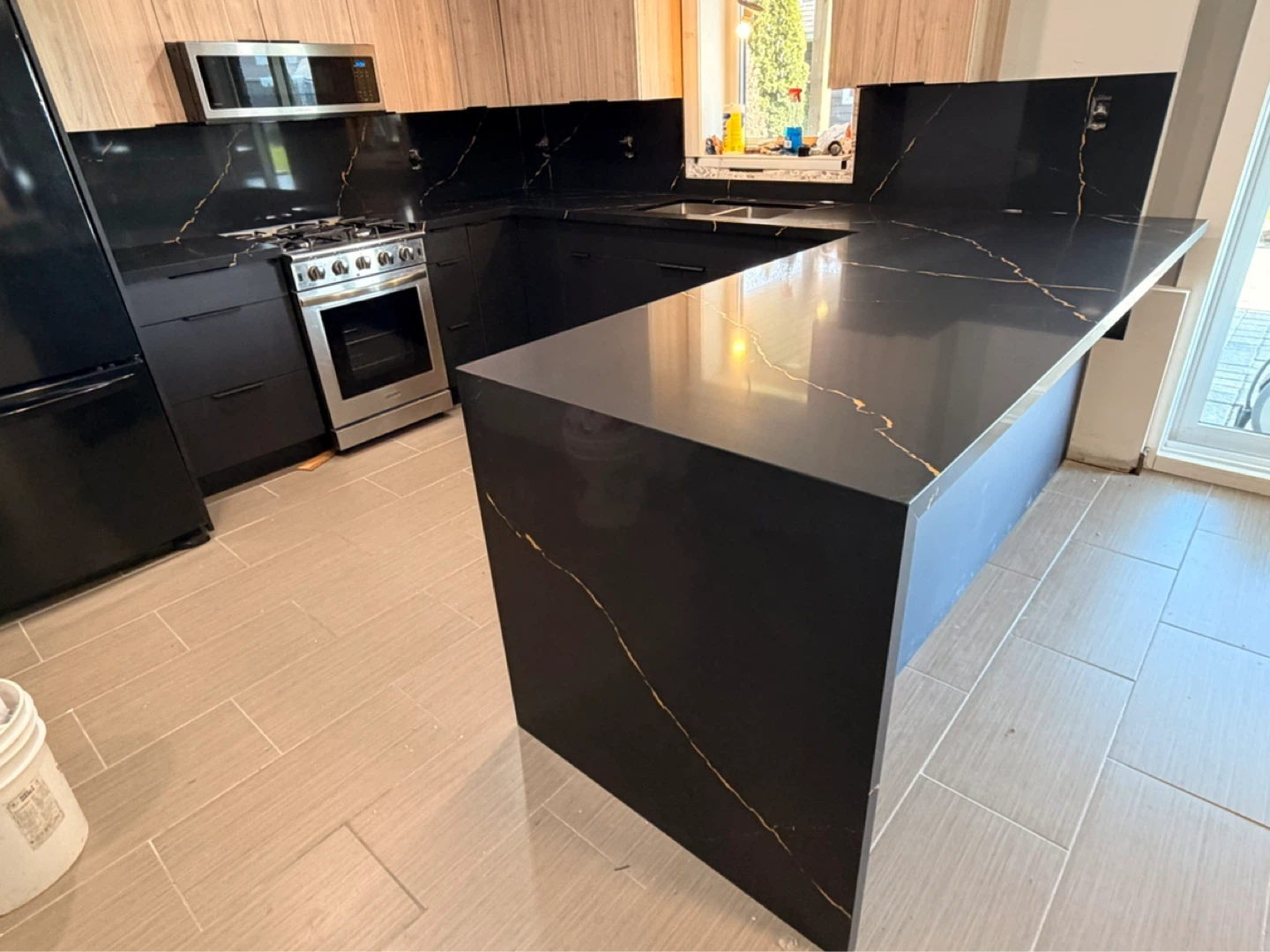 Black Quartz Countertop with Gold Veining - photo 3