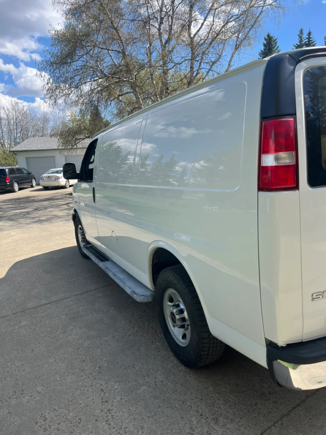 White GMC Savana Cargo Van