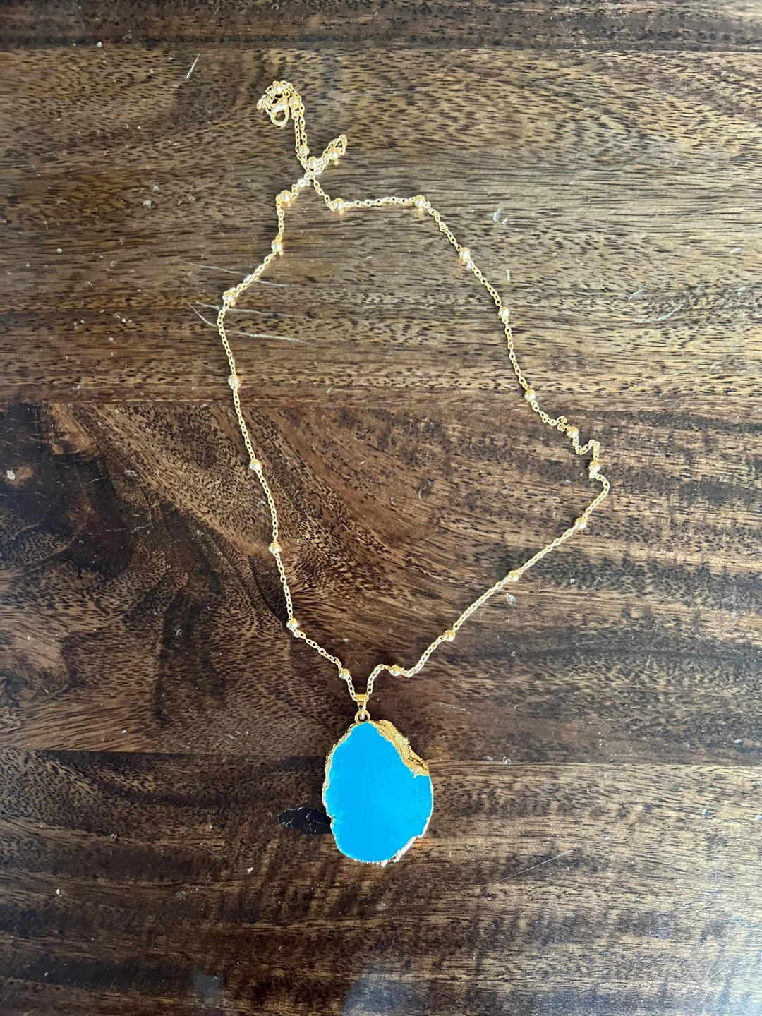 Gold-tone Necklace with Blue Pendant