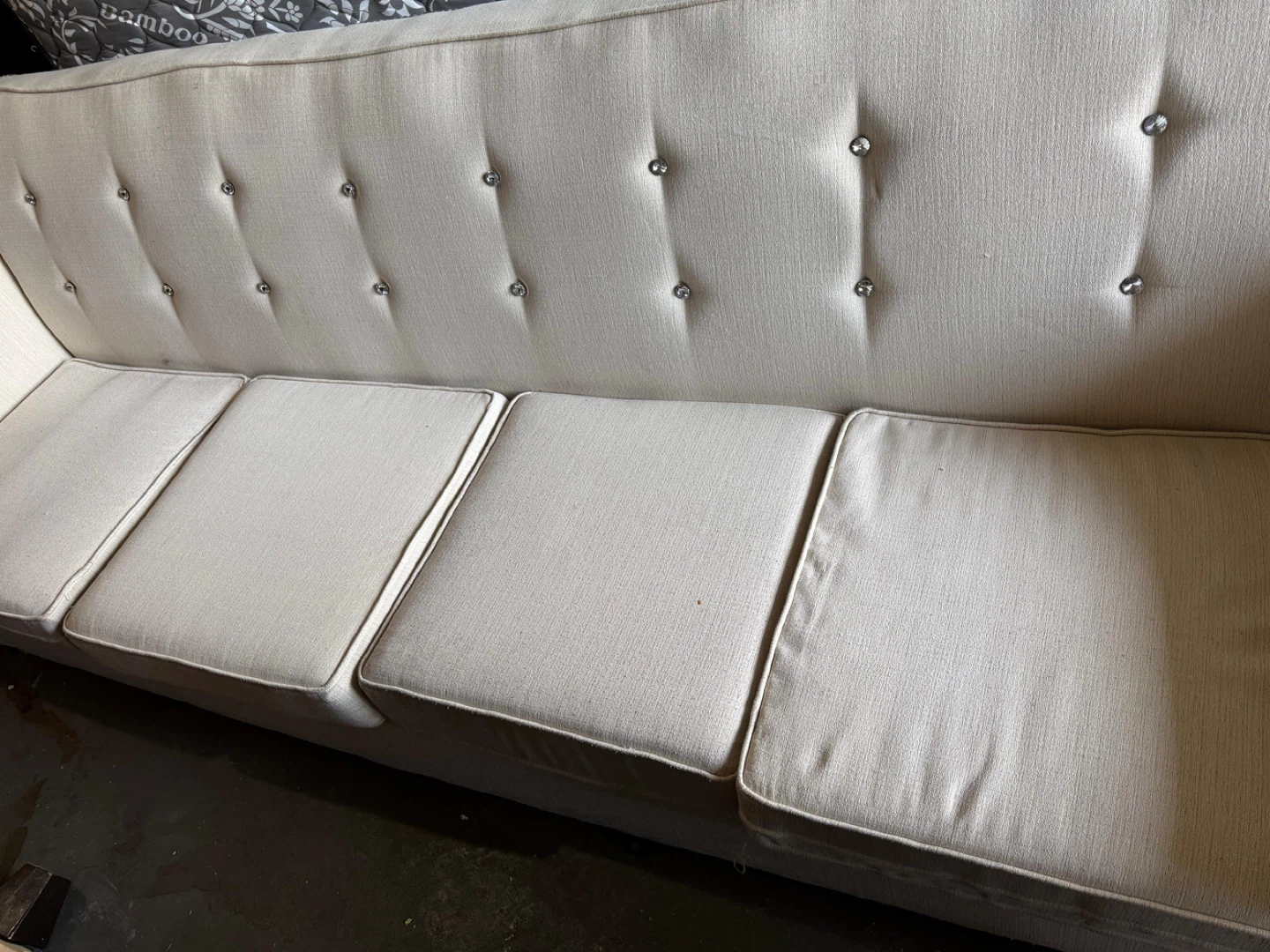 Cream Upholstered Sofa with Tufted Back