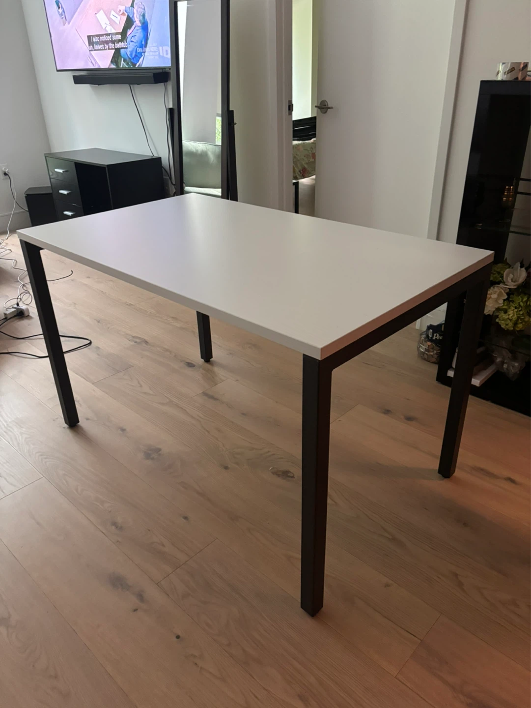 White rectangular table with black metal legs