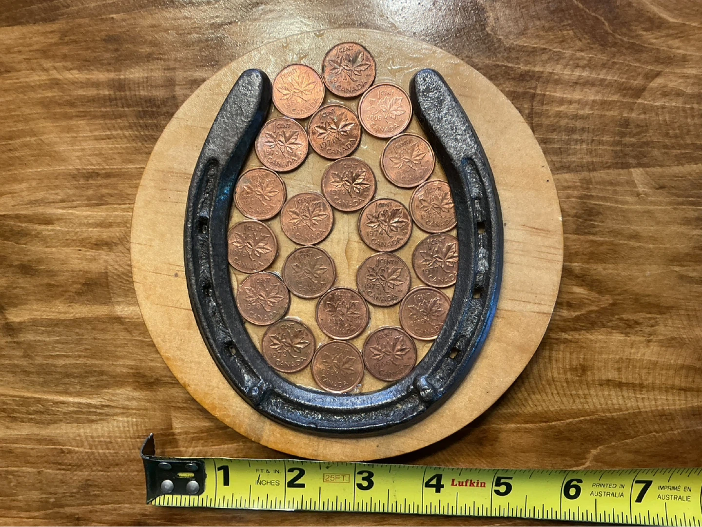 Antique Lucky Horse Shoe with Canadian Pennies on Wood Plaque