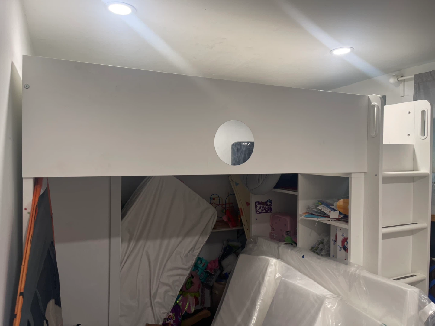 White Loft Bed with Integrated Shelves and Ladder