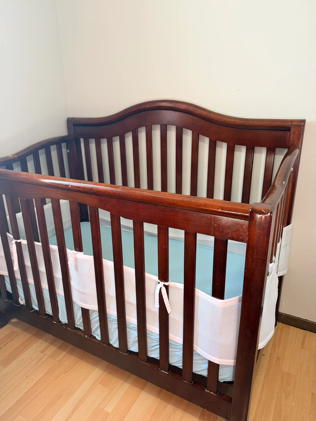 Wooden Baby Crib with Changing Station and Baskets