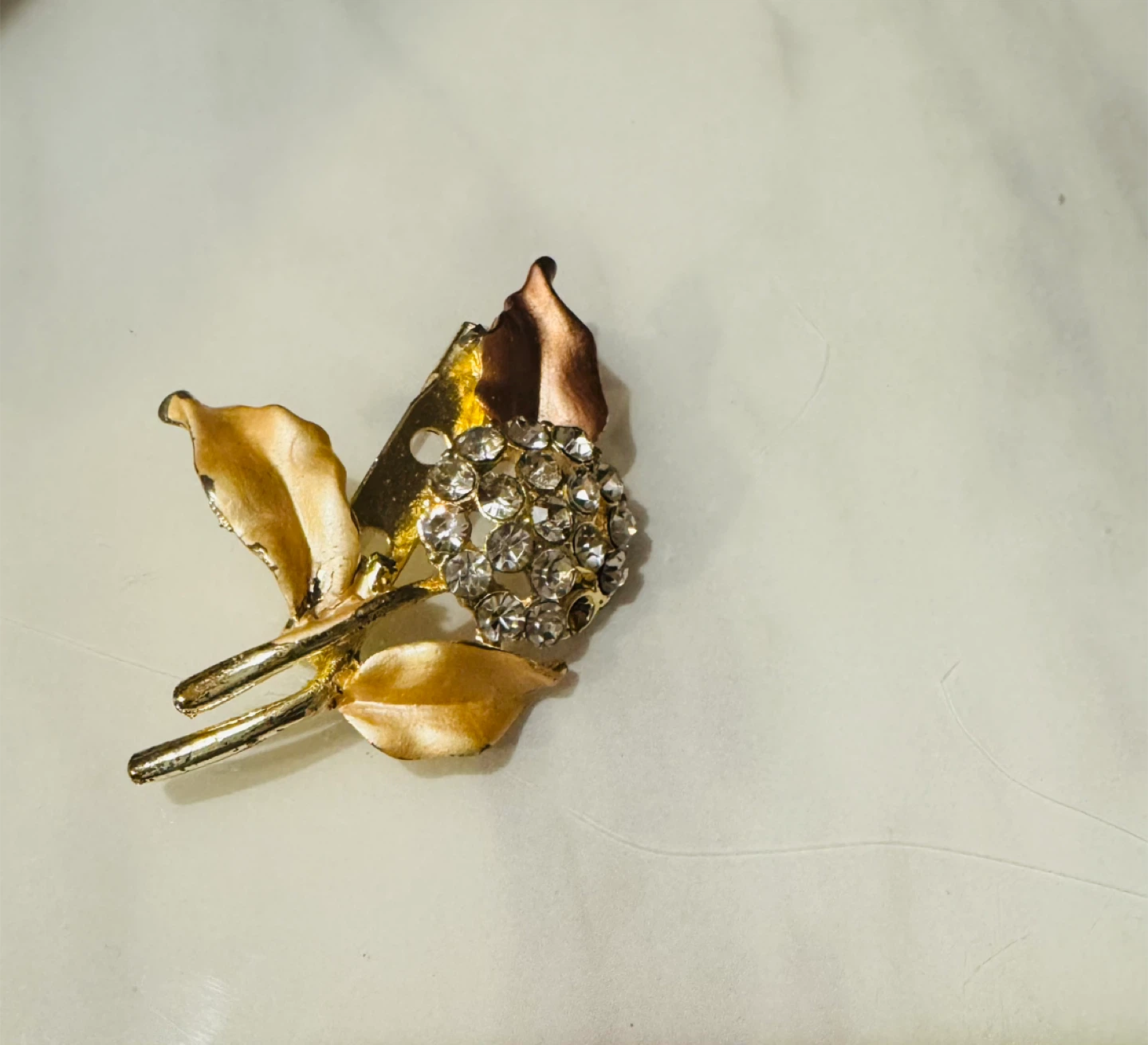 Gold-tone floral brooch with rhinestones