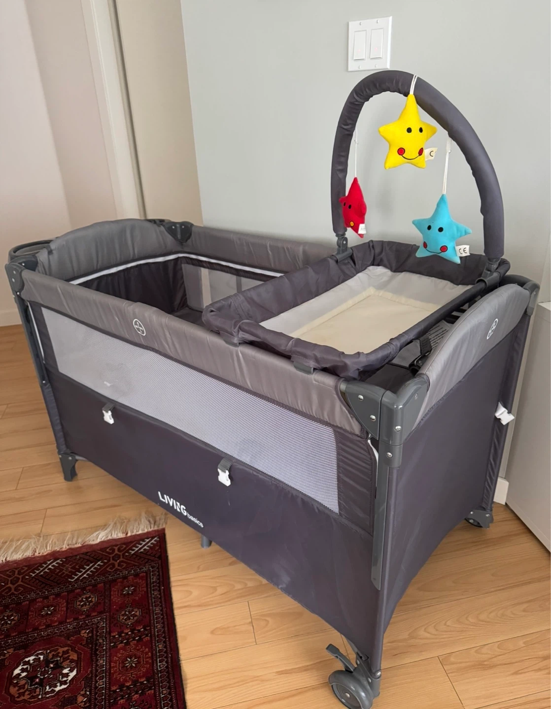LIVINGbasics 4-in-1 Baby Playard Bassinet with Changing Table