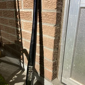 Black Wooden Baseball Bat with Baseball