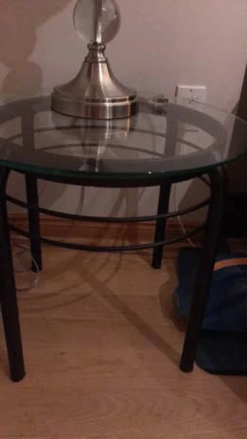 Glass top accent table with black metal frame