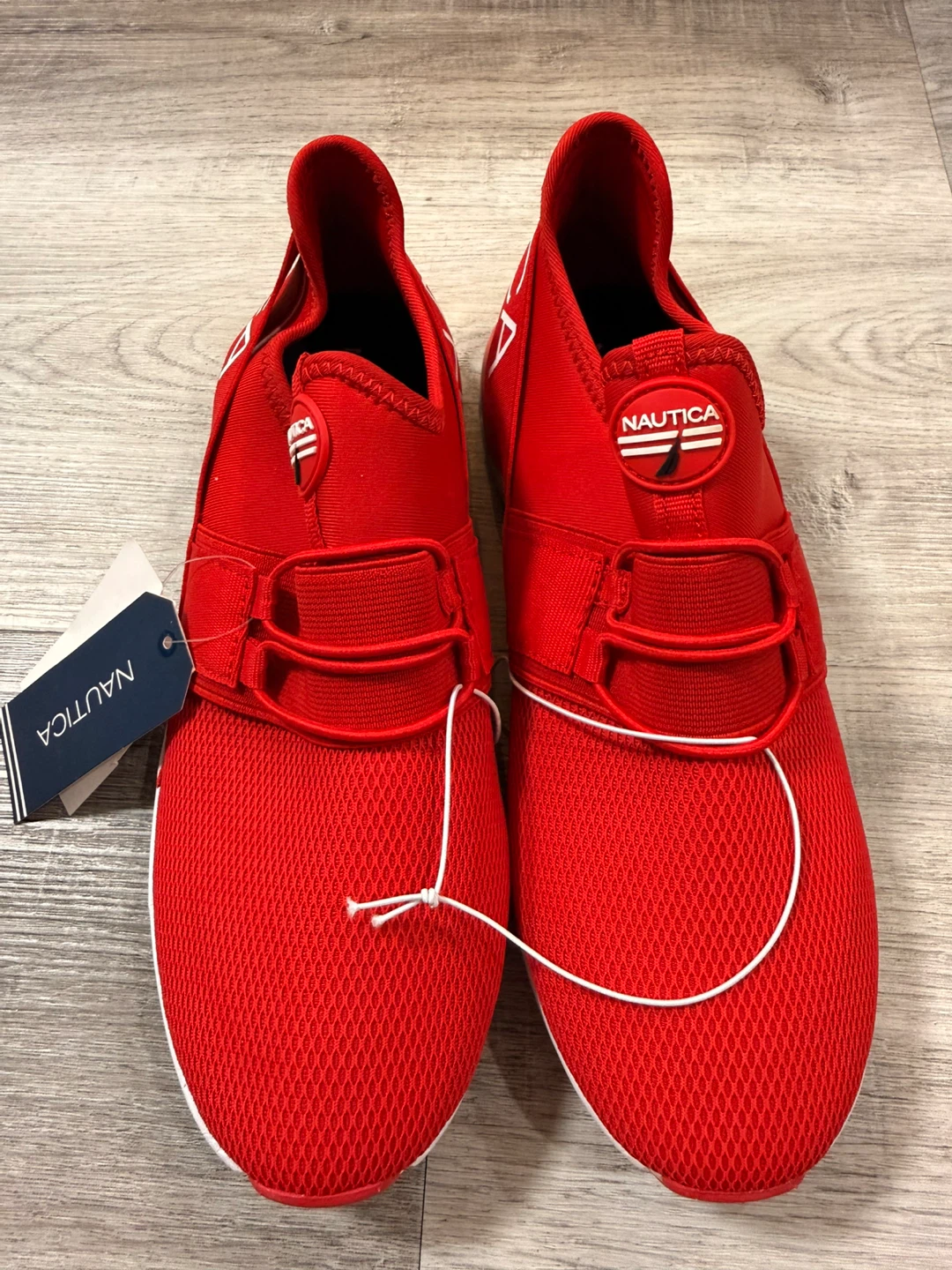 Brand new Nautica slip-on sneakers in bright red.