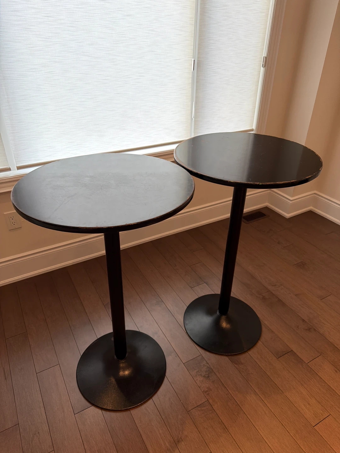 Set of 2 black round pedestal bar tables