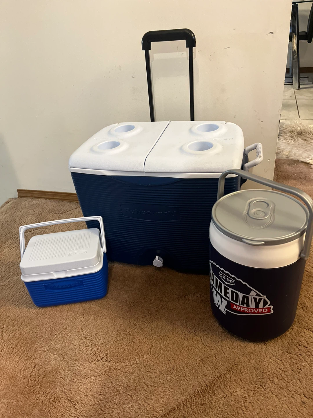 Rubbermaid Rolling Cooler and two smaller coolers