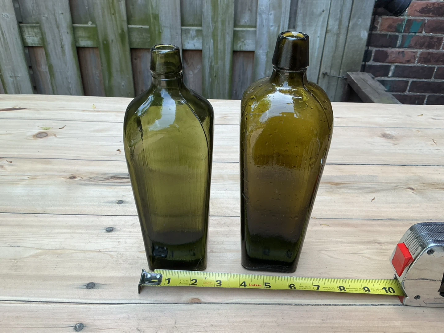 Pair of Antique Dark Green Glass Bottles !