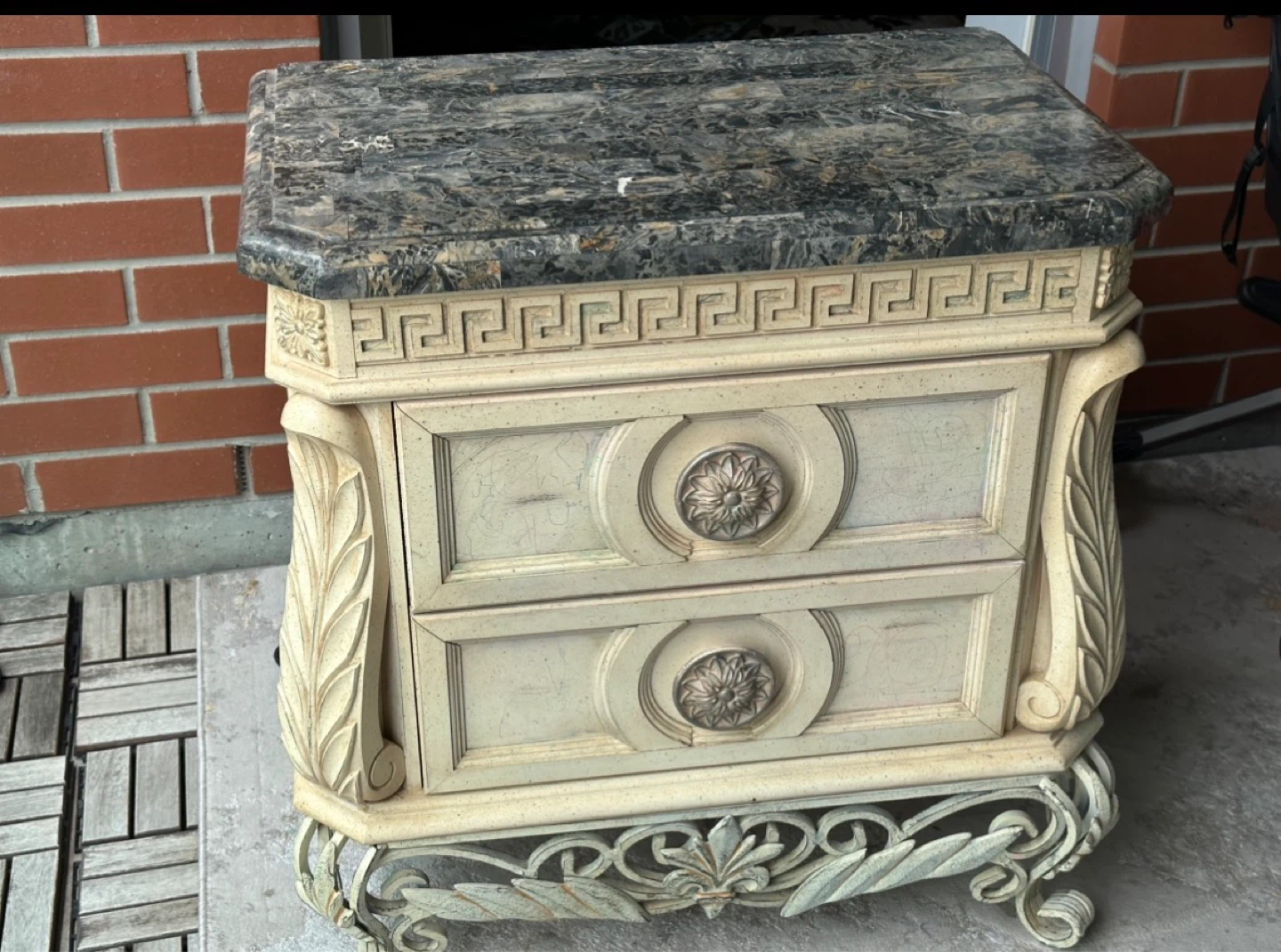 Ornate bedside table with marble top