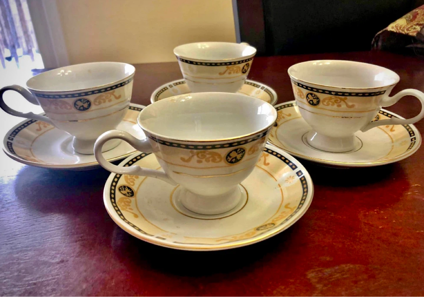 Set of 4 White Porcelain Teacups and Saucers