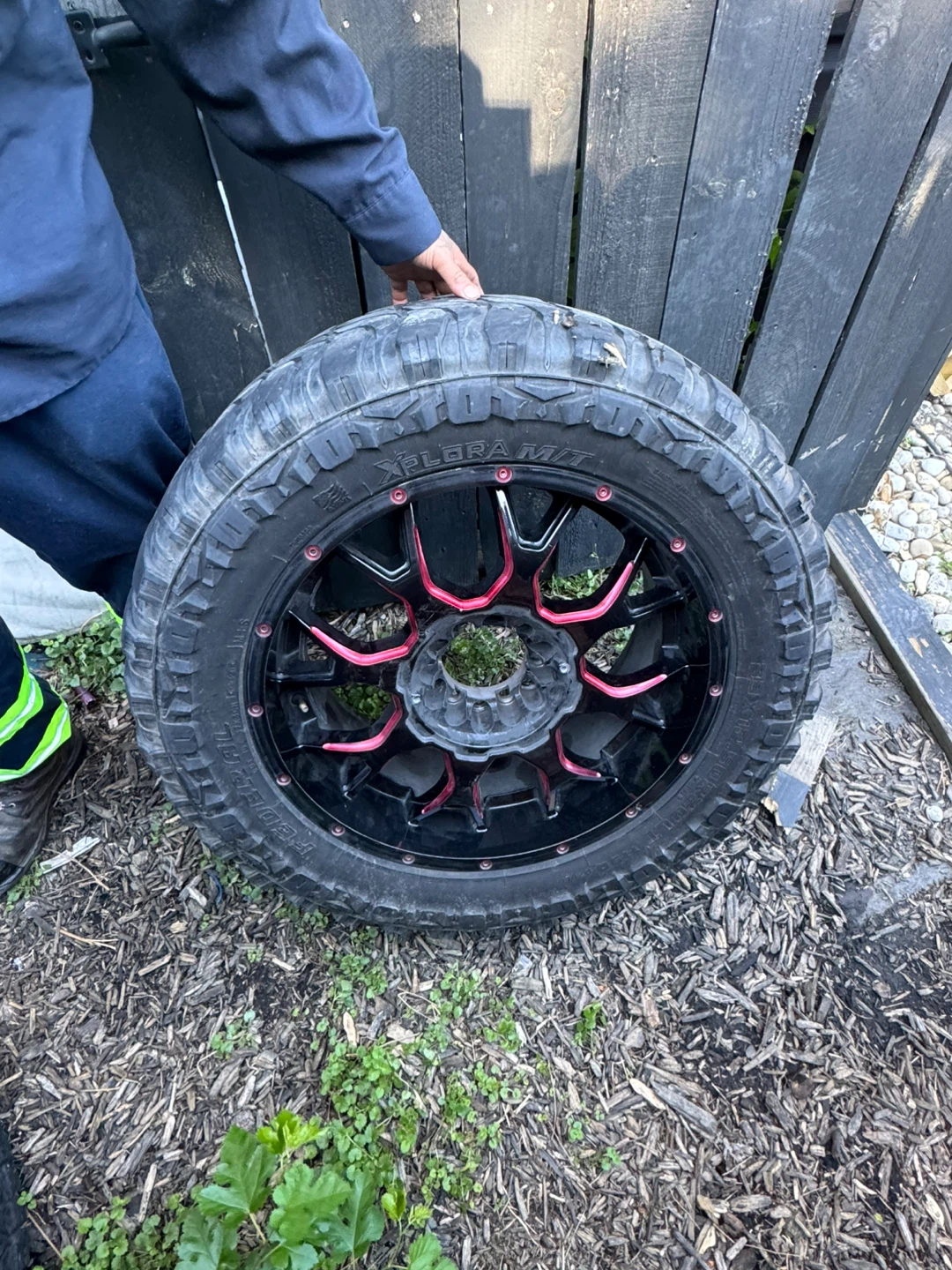 Black and Red Off-Road Tire and Wheel
