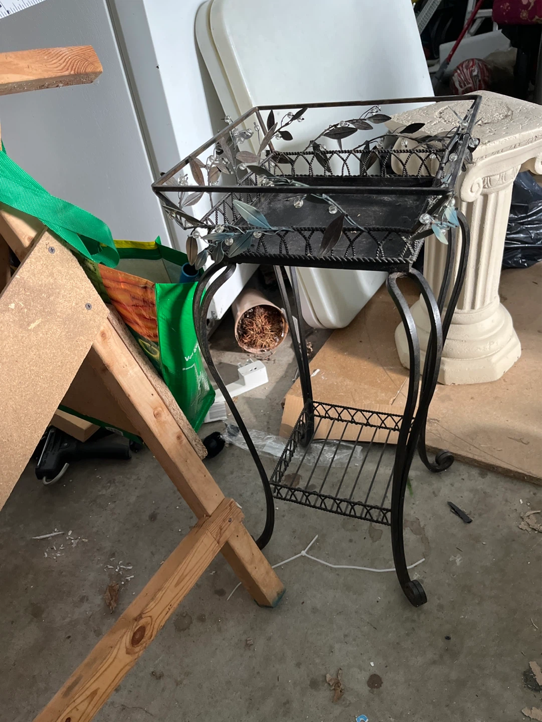 Ornate Metal Plant Stand with Decorative Leaf Accents