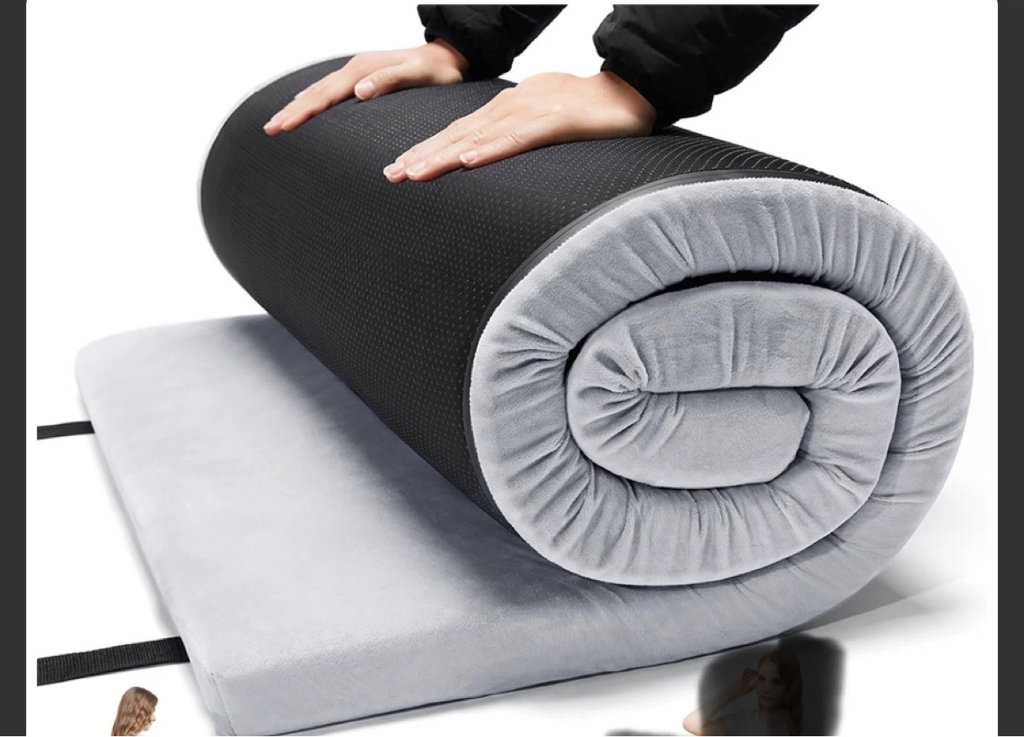 Rolled up mattress with grey plush and black textured cover