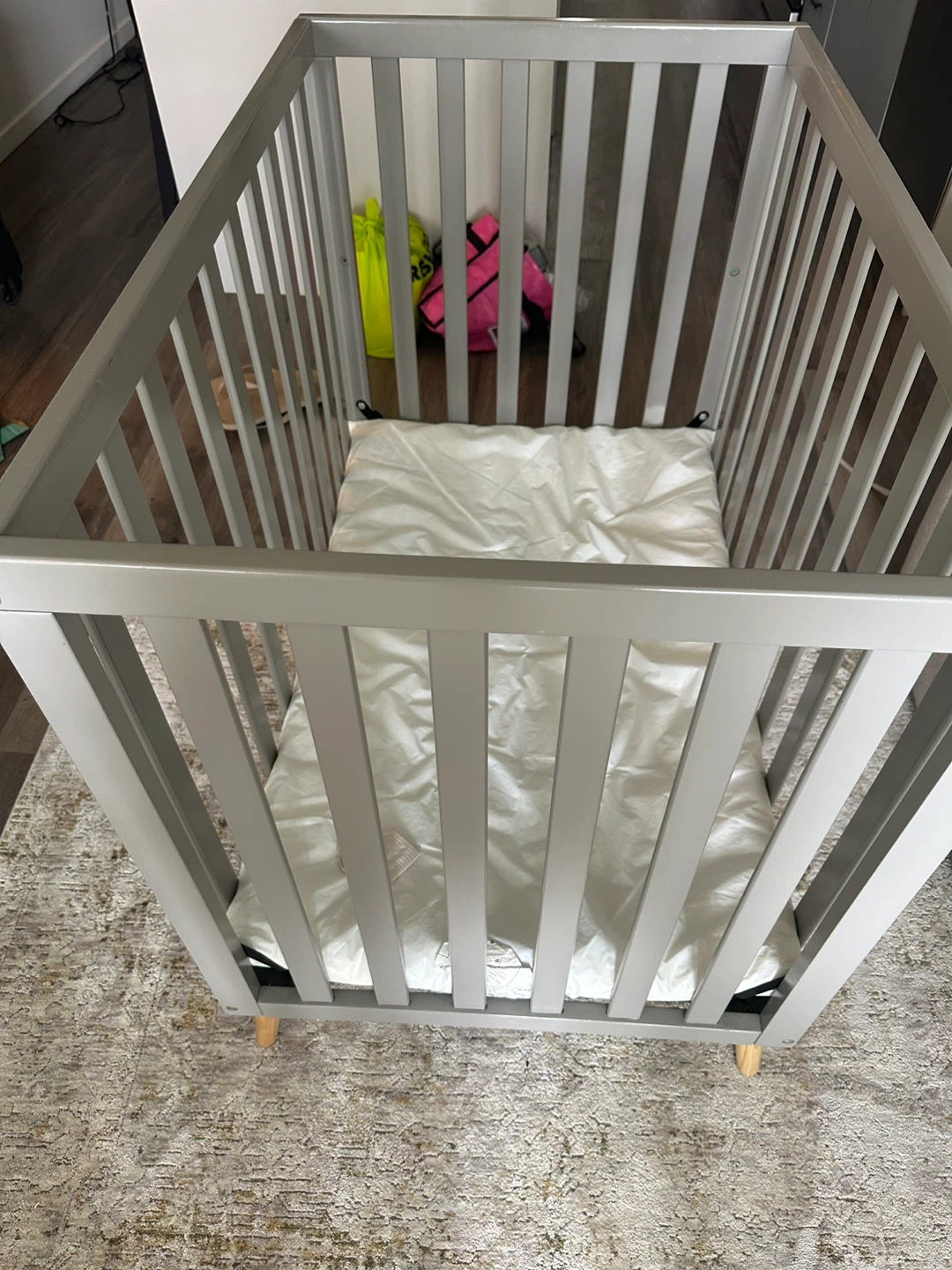 Grey Baby Crib with White Mattress