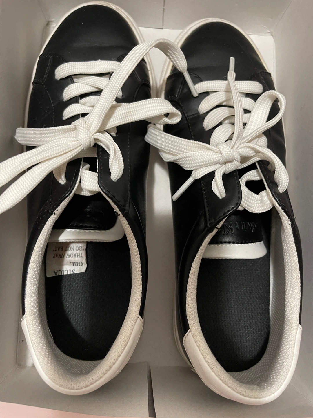 Black Low-Top Sneakers with White Laces