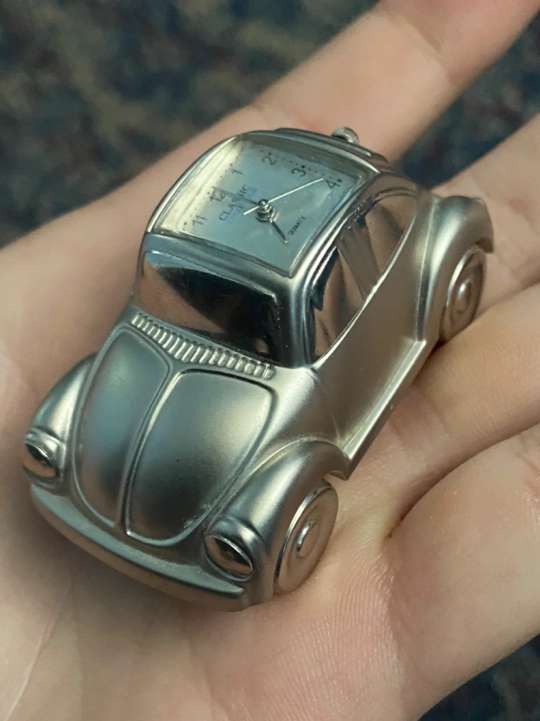 miniature volkswagen beetle clock. silver color 2" x 1 1/4" x 1"