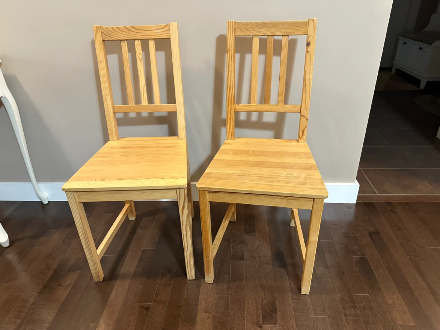 Two wooden dining chairs