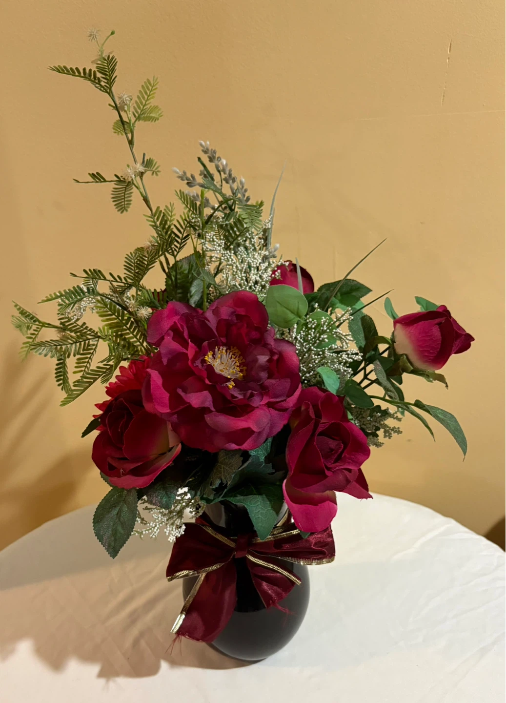 Artificial Flower Arrangement in Black Vase with Burgundy Bow