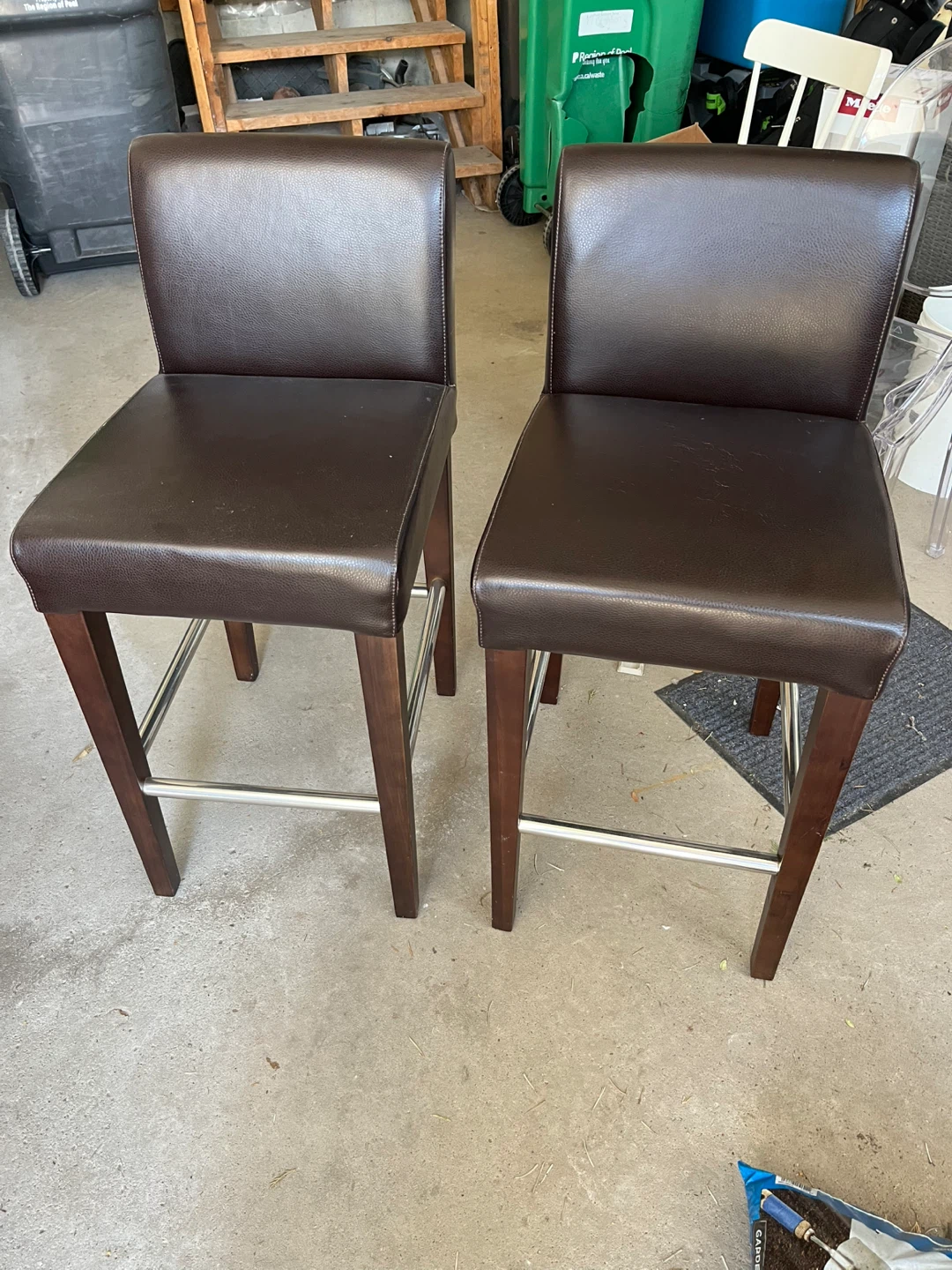 Two leather bar stools