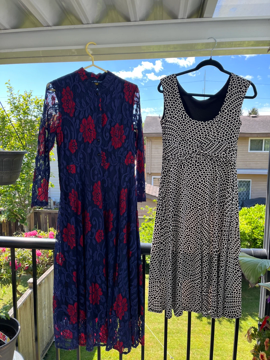Navy floral lace dress and black and white patterned dress