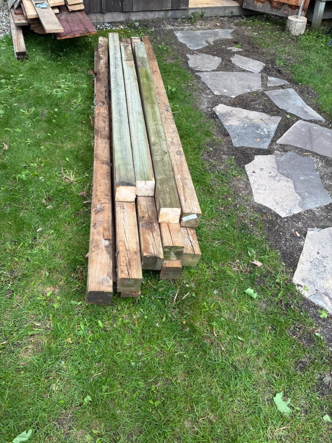 13 Used Pressure Treated Wooden Posts