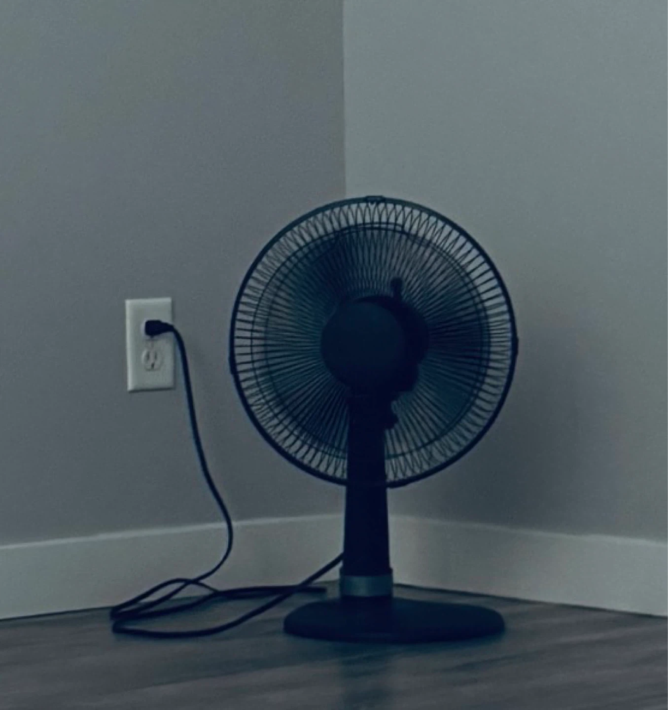 Black oscillating desk fan